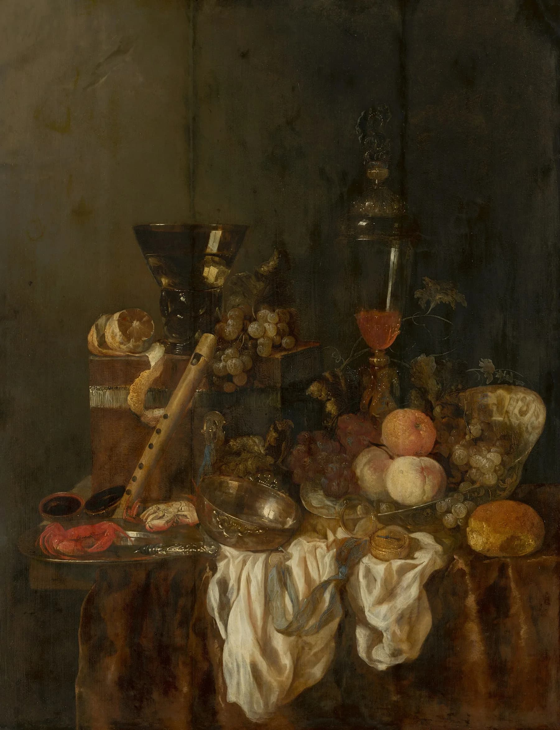 Sumptuous baroque still life with fruit, flowers, and wineglasses in rich amber tones